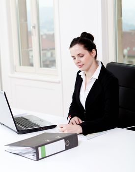 young successful business woman working on computer in office