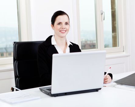 young successful business woman working on computer in office