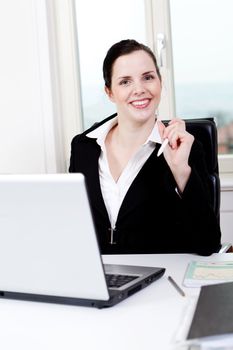 young successful business woman working on computer in office