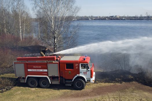  the fire crew extinguishes a burning grass in the settlement  Thresholds on May 04, 2013