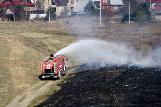  the fire crew extinguishes a burning grass in the settlement  Thresholds on May 04, 2013