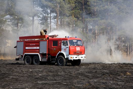  the fire crew extinguishes a burning grass in the settlement  Thresholds on May 04, 2013