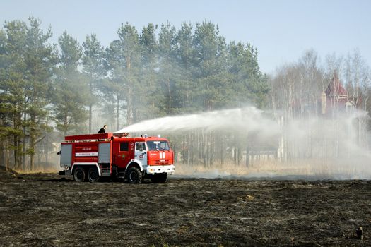  the fire crew extinguishes a burning grass in the settlement  Thresholds on May 04, 2013