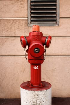 Red Fire Hydrant with the number 64 on it