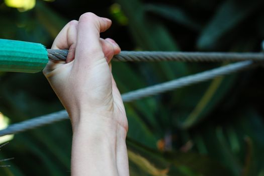 Hand holding onto a Wire rope in full strength