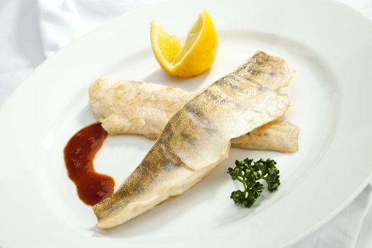 Grilled Pikeperch with lemon and tomato sauce