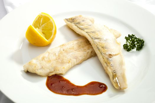 Grilled Pikeperch with lemon and tomato sauce