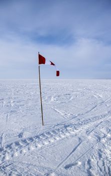 flag in the snow in an open space