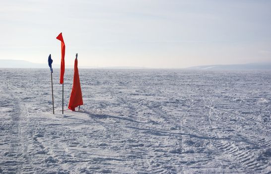 flag in the snow in an open space