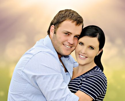 Beautiful young couple with spring background