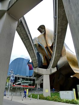 SEATTLE - SEPTEMBER 6: Experience Music Project (EMP) with Seattle monorail running through on September 6, 2011. EMP was designed by Frank Gehry and houses many rare artifacts from popular music history.