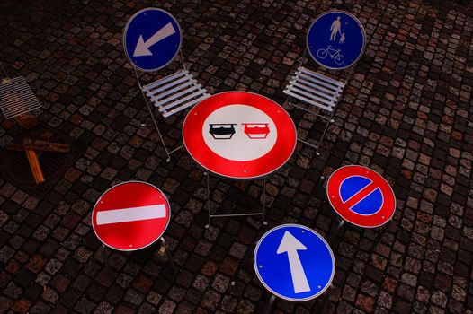 A table and chairs made of traffic signs.