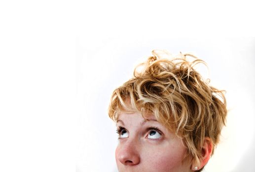 Young blond girl with morning look and mixed hairs on a white background