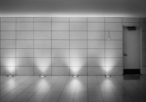 White walls and door in an underground Montreal metro station corridor. Contemporary interior design. This is part of the Square-Victorial tunels.