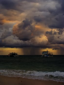 Rainstorm in a sea at sunrise