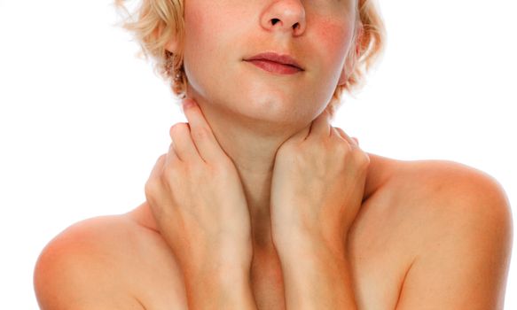 Crop image of calm girl holding her neck - isolated on white background