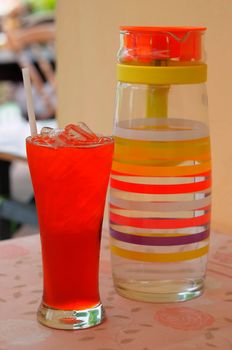 Refreshing glass of iced tea on table