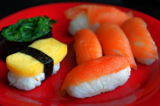close up Fresh rolls  sushi with salmon , seaweed and sweet egg