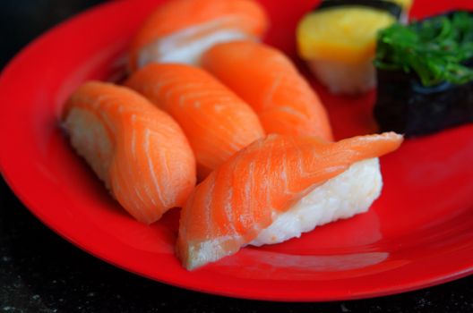 close up salmon sushi on dish , japanese food