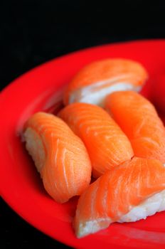 close up salmon sushi on dish , japanese style cuisine