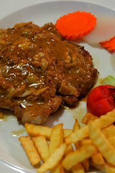beef steak with vegetable , tomato and  french fries