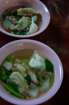 Wonton noodles.  vegetable and pork soup , asian noodles