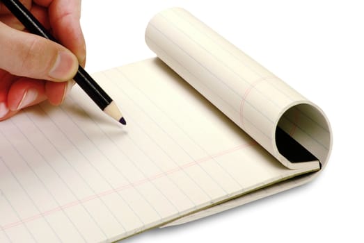 Pencil in hand writing on the notebook