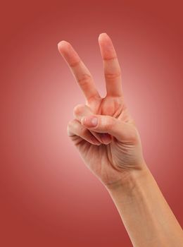 Hand with two fingers up in the peace or victory symbol. Also the sign for the letter V in sign language.