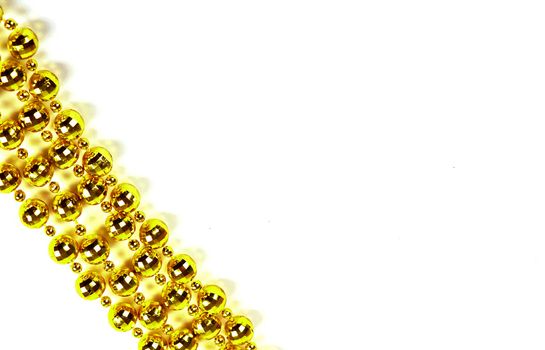 Background made of a brilliant celebratory beads of golden color