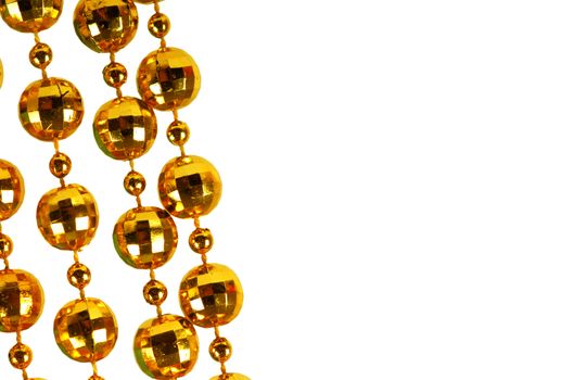 Background made of a brilliant celebratory beads of golden color