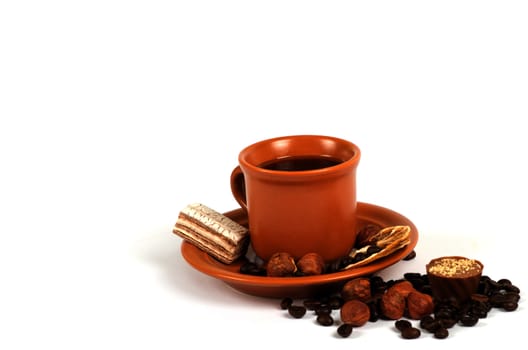 Cup of coffee with ingredients on a white background