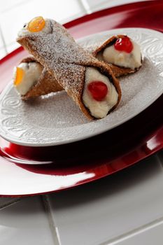 Two Tasty Cannoli on a Plate.