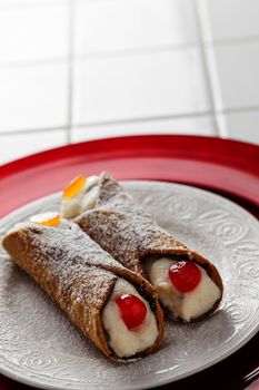 Two Tasty Cannoli on a Plate.