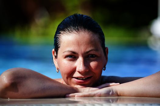 Portrait of happy girl in pool