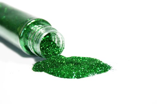 green glitter powder getting out from a bottle