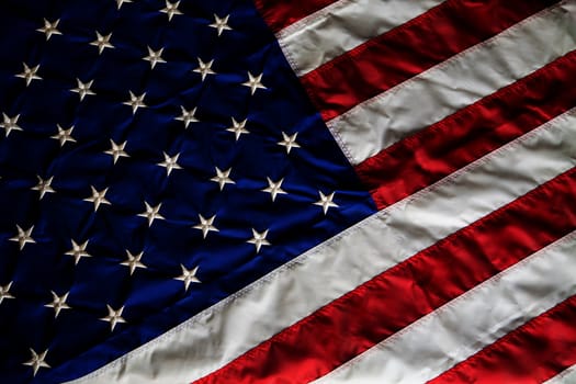 Crumpled, vintage American flag. Real photo. Closeup.