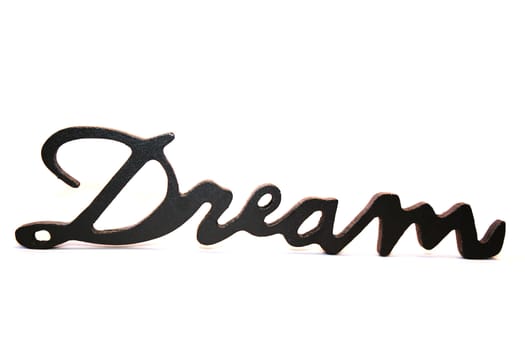 Close up of the word dream on a white background