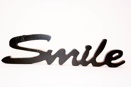 Close up of the word smile  on a white background