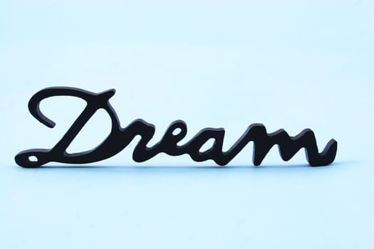 Close up of the word dream on a white background