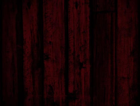 Background of grungy old wood planks in dark red tones