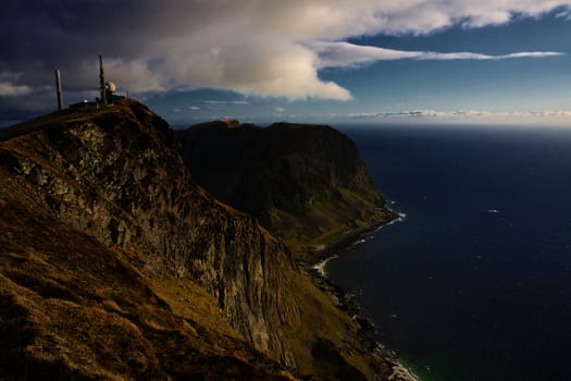 Scenic coastal cliffs on island of Vaeroy, Lofoten islands in Norway