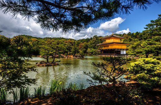 A view of Kinkakuji Temple (The Golden Pavilion) in Kyoto, Japan on a beautiful day in Spring