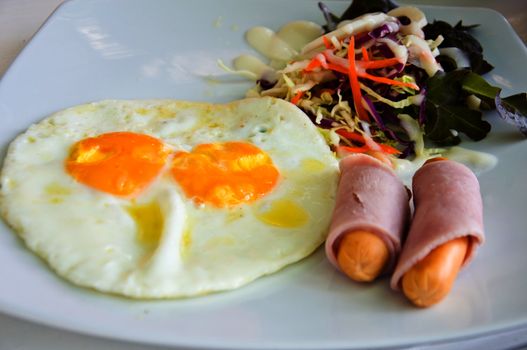 fried egg and salad for  breakfast meal