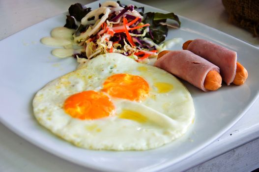 fried egg and salad for  breakfast meal