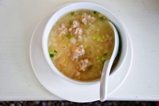 boil rice with pork for meal