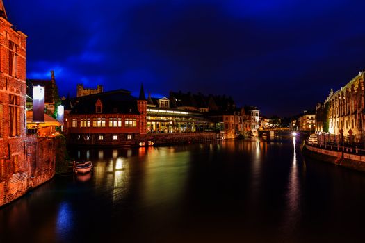 Travel Europe Belgium background - Ghent canal in twilight the evening. Ghent, Belgium