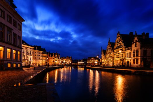 Travel Europe Belgium background - Ghent canal, Graslei and Korenlei streets in twlight the evening. Ghent, Belgium