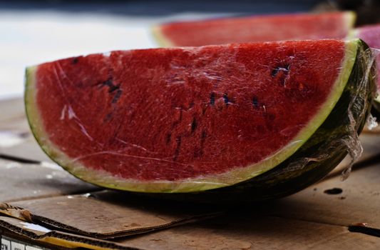 fresh water melon slices for sale at market