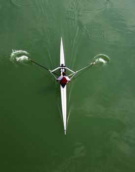 man rowing in kayak down the river.