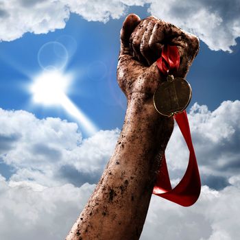 hand holding a winner's medal, success in competitions